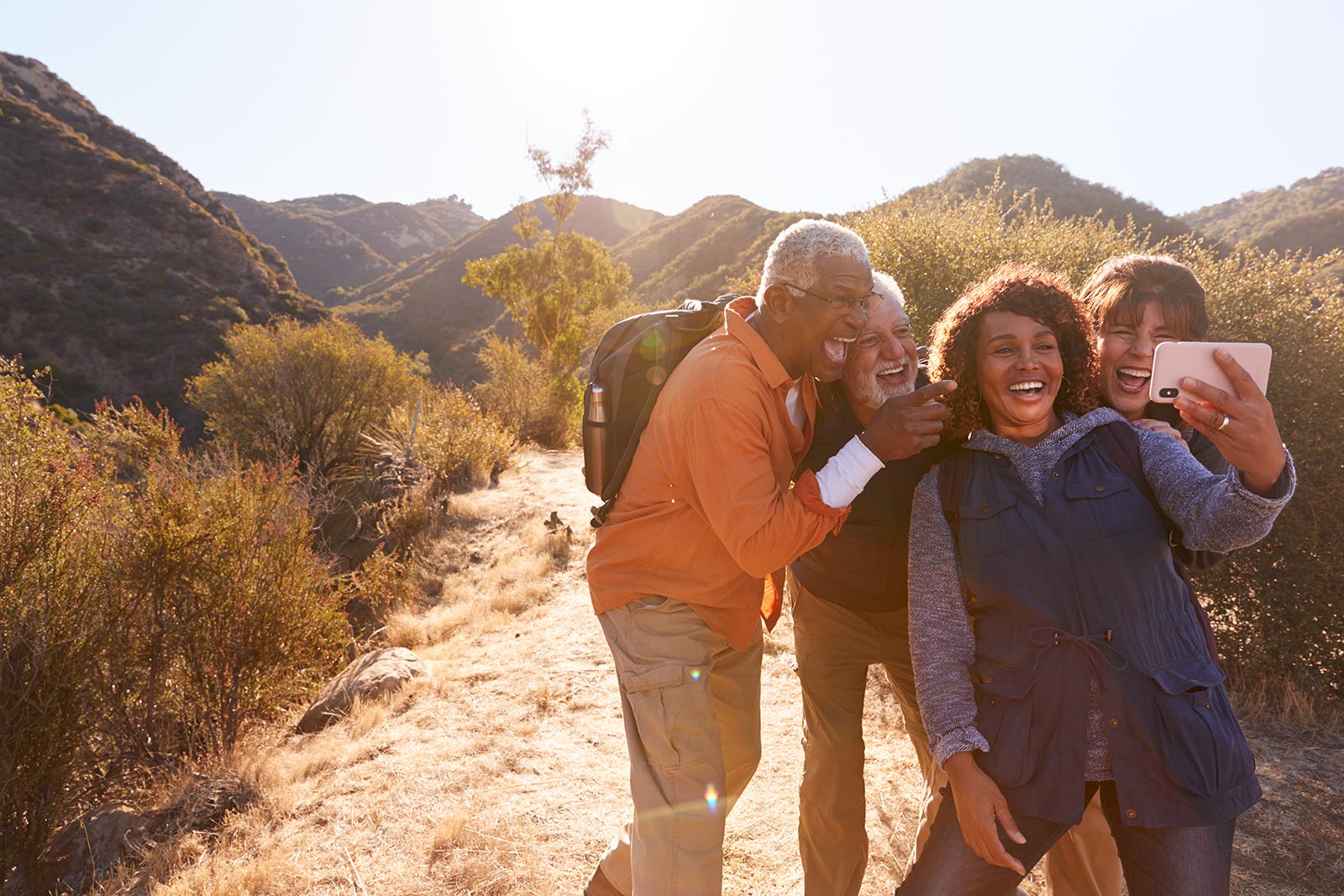 Group of elderly hikers taking selfie