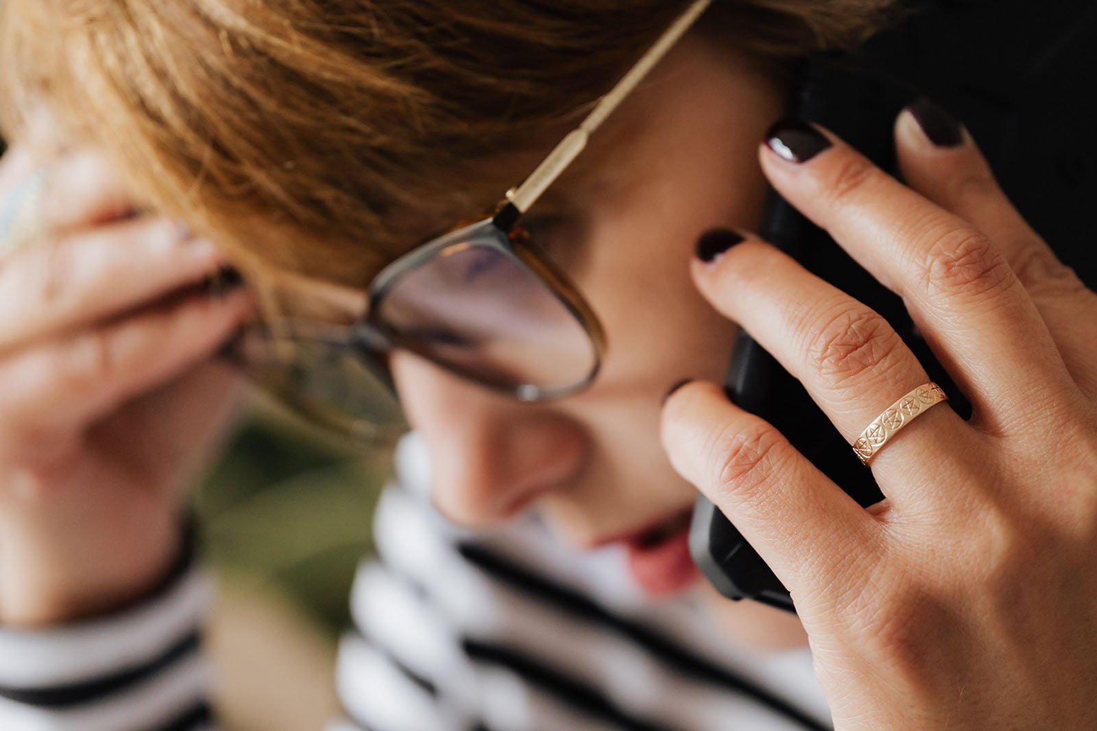 Distressed woman talking on cellphone