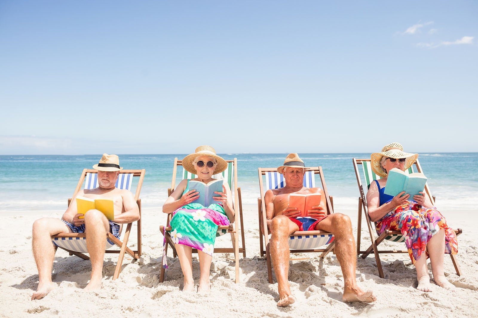 Group of seniors relaxing on the beach