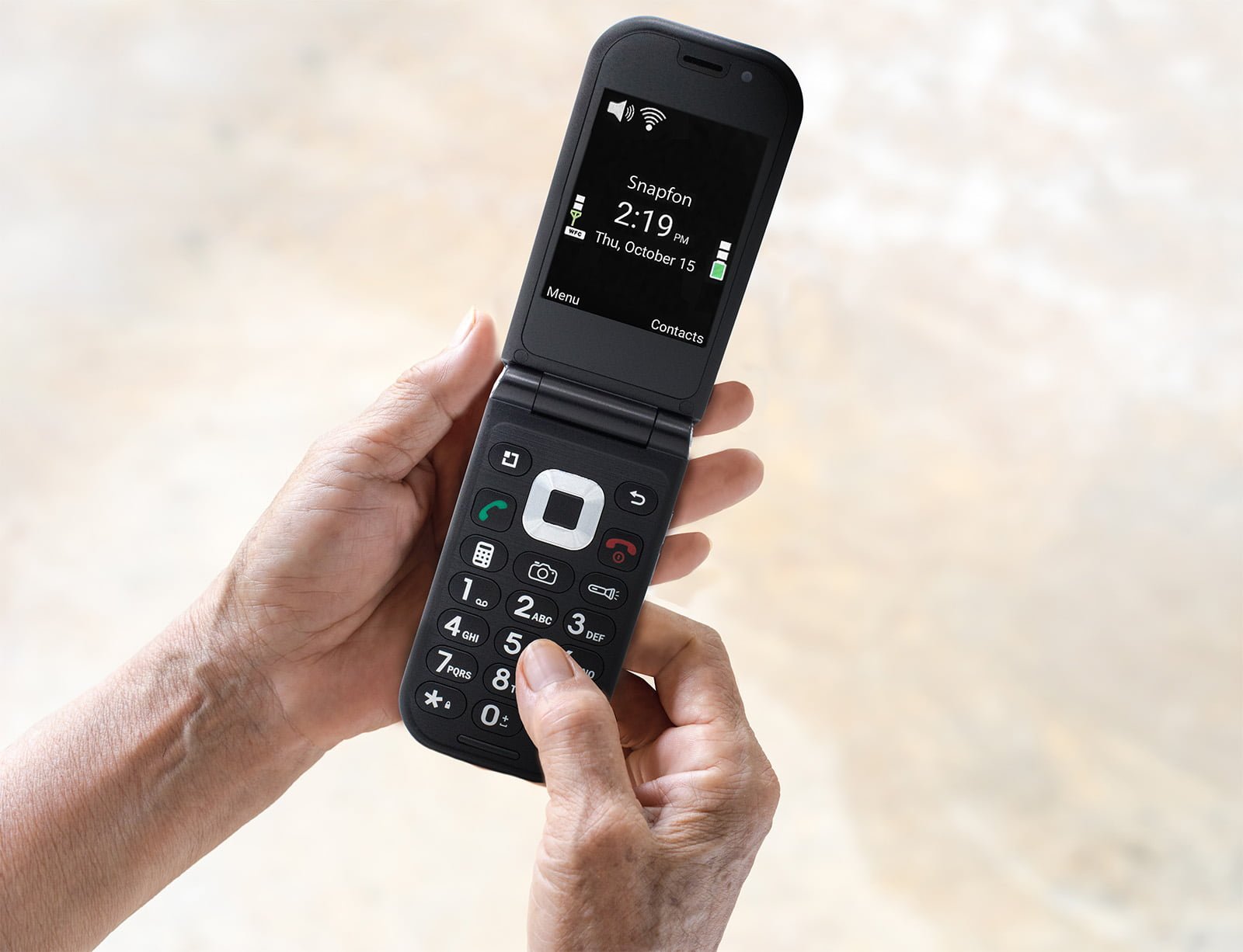 Elder holding ezFlip phone