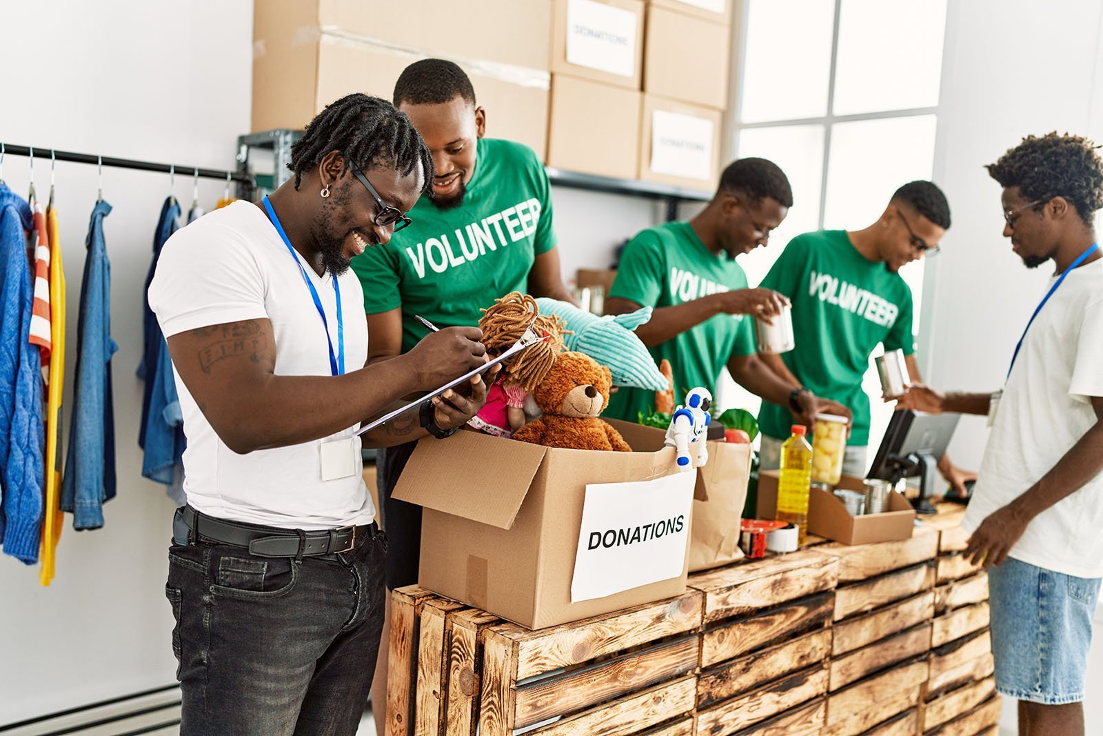 A group of volunteers sort through donations